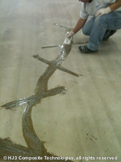 concrete crack repair - squeegee epoxy through crack
